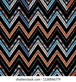 Seamless ethnic zigzag chevron pattern. Hand drawn colorful geometric background. Striped tribal motifs. Vector illustration