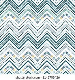 Seamless ethnic zigzag chevron pattern. Hand drawn colorful geometric background. Striped tribal motifs. Vector illustration