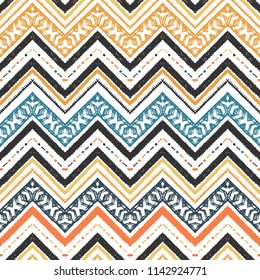 Seamless ethnic zigzag chevron pattern. Hand drawn colorful geometric background. Striped tribal motifs. Vector illustration