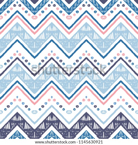 Seamless ethnic zigzag chevron pattern. Hand drawn colorful geometric background. Striped tribal motifs. Vector illustration