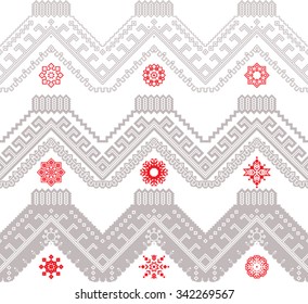 Seamless ethnic zigzag and red solar symbols.
