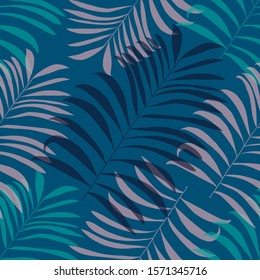 Seamless exotic pattern with palm leaves on blue background