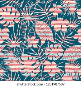 Seamless exotic pattern with tropical plants and stripes background. Modern abstract design for paper, cover, fabric, interior decor and other users.