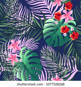 Seamless exotic tropical pattern with palm leaves and hibiscus flowers. Summer print. Vector illustration for textile design.