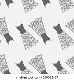 Seamless fabric pattern with clothes, lace dress collection, repeating fabric texture. Vector fashion background Hand drawn illustration for wrapping paper, scrapbook, invitations or cards design.