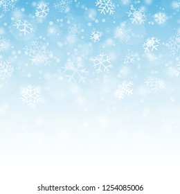 seamless fall of snow flakes and blue colored background
