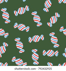 Seamless fashion red white and blue candy on green background