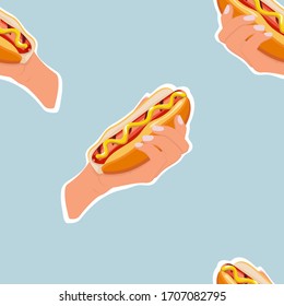 Seamless fast food pattern of hot dogs with buns in hand, grilled sausages, spicy mustard sauce isolated on light blue background. Colorful sandwiches vector pattern for street food or takeaway menu