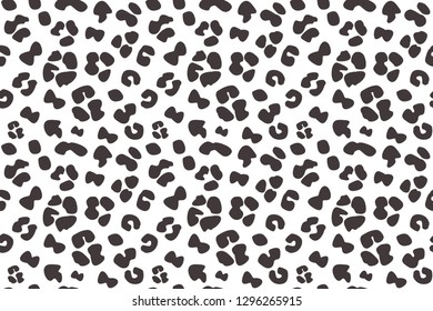 Seamless faux leopard skin pattern with big black spots on white background. Vector - EPS.