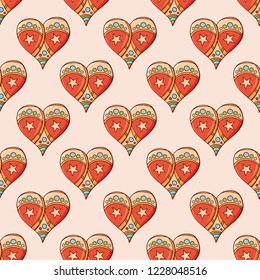 Seamless festive pattern with hand-drawn christmas gingerbread hearts. Endless traditional texture for Christmas design, fabrics, wallpapers, greeting cards, wrappings. Vector color illustration.