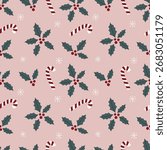 Seamless festive pattern with holly leaves, berries and candy canes on a soft pink background. Great for gift wrap, party supplies, textile and seasonal stationery.
