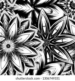 Seamless floral background. Tracery handmade nature ethnic fabric backdrop pattern with saturated dark flowers. Textile design texture. Decorative binary monochrome black and white art. Vector