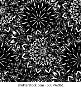Seamless floral background. Tracery handmade nature ethnic fabric backdrop pattern with flowers. Textile design texture. Decorative binary monochrome black and white art. Vector.