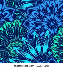 Seamless floral background. Tracery handmade nature ethnic fabric backdrop pattern with flowers. Textile design texture. Decorative color art. Vector.
