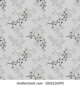 Seamless floral background.Pattern with flowers and buds.White flowers on a gray background with shadows.For decoration of fabric,paper,packaging, Wallpaper.