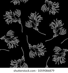 Seamless floral black and white pattern with delicate branches of stylized mimosa flower. White silhouettes on gray background. Vintage style. 