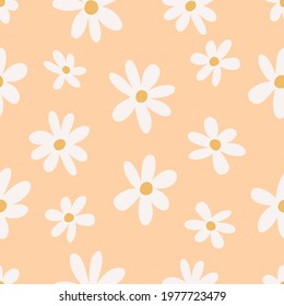 Seamless floral chamomile pattern in trendy boho style on a peach background. Abstract hippie botanical retro pattern in 70s style. Contemporary design for wrapping paper, covers and fabric.