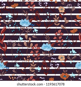 Seamless floral ditsy pattern with wild flowers on ribbon backgr