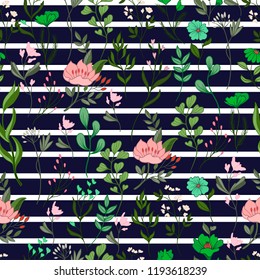 Seamless floral ditsy pattern with wild flowers on ribbon backgr