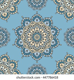 Seamless floral mandala pattern in ivory yellow, teal & grayish cyan on pale turquoise blue background. Vintage vector ornamental print with Oriental style elements of Indian/Arabic decorative arts.