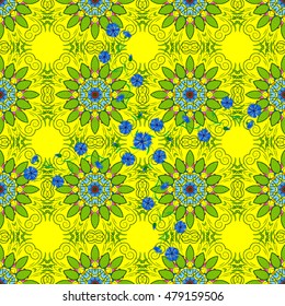 Seamless floral mandala pattern, turquoise green on floral yellow background.