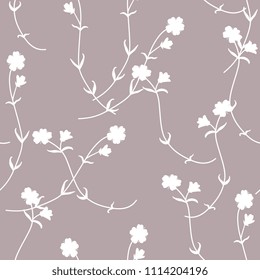 Seamless floral monochrome pattern with silhouettes of wild meadow flowers.