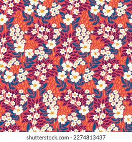 Seamless floral pattern, artistic ditsy print of hand drawn flora with retro motif. Beautiful botanical design with a wild garden: small flowers, grass, leaves on a red background. Vector illustration
