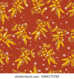 Seamless floral pattern with autumn leaves of rowan or ash tree and snowflakes. On red background.