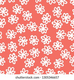 Seamless floral pattern background. Coral colour, endless hand drawing abstract doodle of falling bloom flowers with petals. Vector.