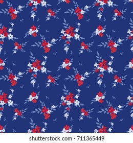 Seamless floral pattern. Background in small blue flowers on a blue background for textiles, fabrics, cotton fabric, covers, wallpapers, print, gift wrapping, postcard, scrapbooking.