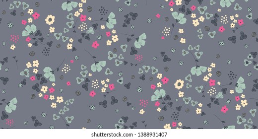 A seamless floral pattern background with tiny pink and cream flowers featuring a dark grey background