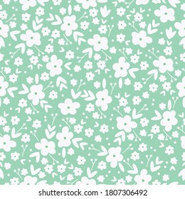 Seamless floral pattern. Beautiful white flowers ornament on a green background. The print is suitable for Wallpaper.