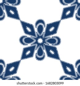 Seamless floral pattern with blue stylized flowers. Decorative background.
