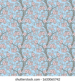 Seamless floral pattern with branches covered with pink cherry flowers on a sky blue fond. Traditional Japanese vintage textile pattern.