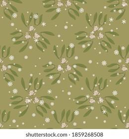 Seamless floral pattern with branches of mistletoe plant and snowflakes.