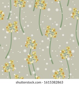 Seamless floral pattern with branches of yellow narcissus or daffodil flower and snowflakes.