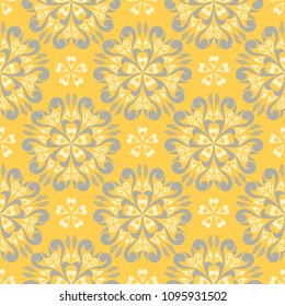 Seamless floral pattern. Bright yellow background with flower designs for wallpapers, textile and fabrics