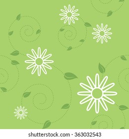 The seamless floral pattern with chamomiles and green leaves