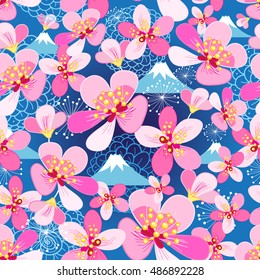 Seamless floral pattern of cherry blossoms on a blue background