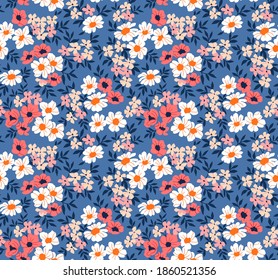 Seamless floral pattern for design. Small pink and white flowers. Blue background. Ditsy floral texture. A allover floral design in bright colors. Stock vector illustration.