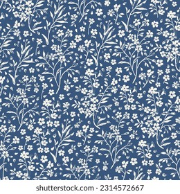 Seamless floral pattern for design. Small white flowers. Blue background. Modern floral texture. Floral pattern all over the body. An elegant template for fashionable prints.