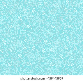 Seamless floral pattern for design. Small white flowers and leaves. Light blue fond. Modern floral background. The elegant the template for fashion prints.