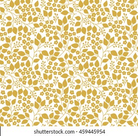 Seamless floral pattern for design. Small gold flowers and leaves. White fond. Modern floral background. The elegant the template for fashion prints.