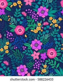 Seamless floral pattern for design. Small-scale flowers and leaves. Dark blue background. Modern floral texture. A allover floral design in bright colors. The elegant the template for fashion prints