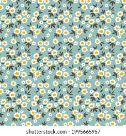 Seamless floral pattern. Ditsies background of small white flowers and khaki leaves. Small-scale flowers scattered over a blue gray  background. Stock vector for printing on surfaces and web design.