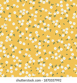 Seamless floral pattern. Ditsy on a background of small white flowers. Small flowers scattered on a yellow background. Stock vector for printing on surfaces and web design.