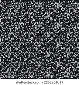 Seamless floral pattern. Doodle background with flowers. Spring pattern