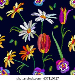 Seamless floral pattern with embroidered pansies, tulips and chamomiles. Retro textile collection.