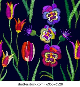 Seamless floral pattern with embroidered tulips, pansies, peonies and thistle. Retro textile collection.
