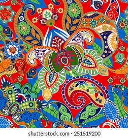 Seamless floral pattern in ethnic style. Bright indonesian batik. Pattern with stylized flowers and paisley. Design for fabric, web, textile, wrapping paper, cover.